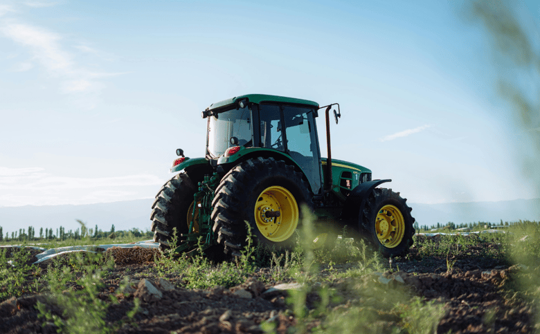 A John Deere Tractor in a Field